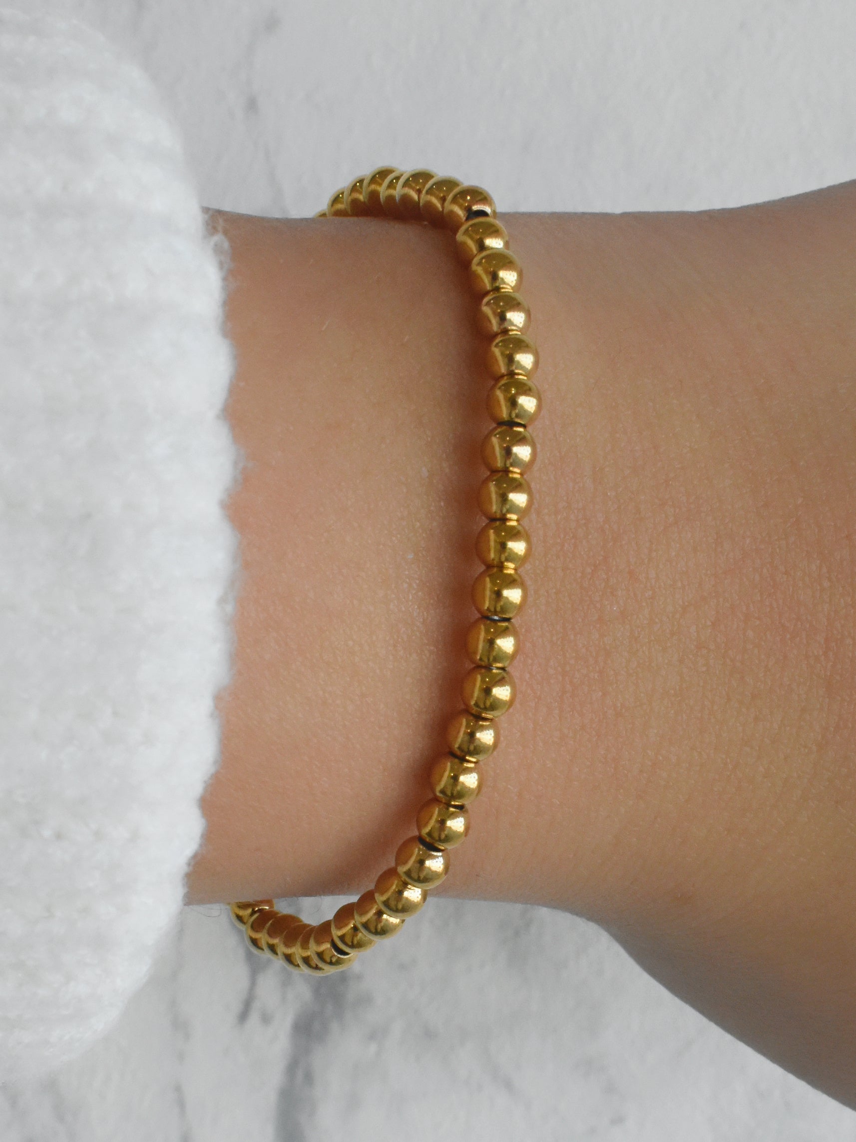 Pulsera elástica bolitas