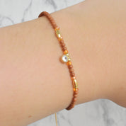 Pulsera mini bolitas circonia (café, colores, morado, rosa)