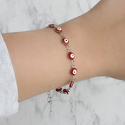 Pulsera plateada ojitos (rosa y roja)
