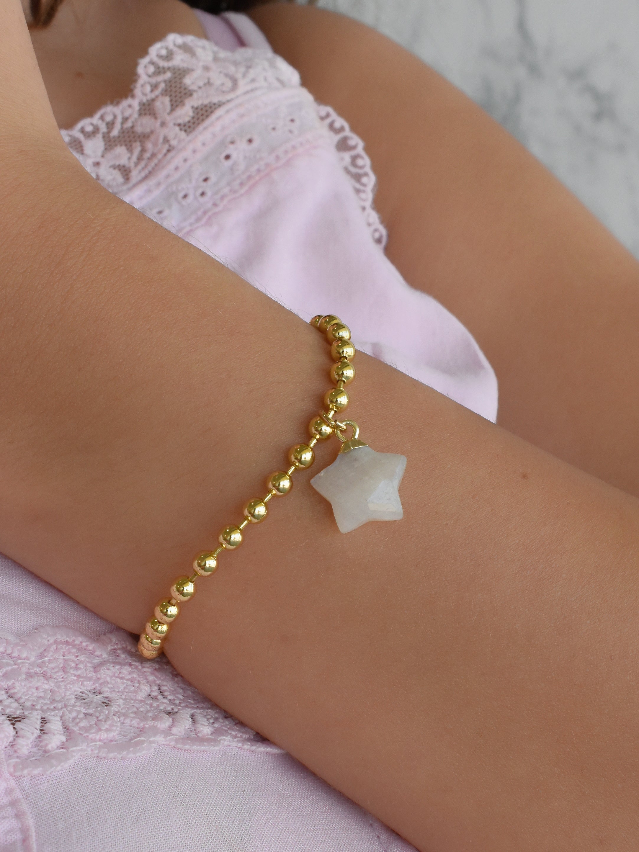 Pulsera bolitas dije estrella blanca