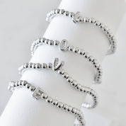 Pulsera inicial plateada