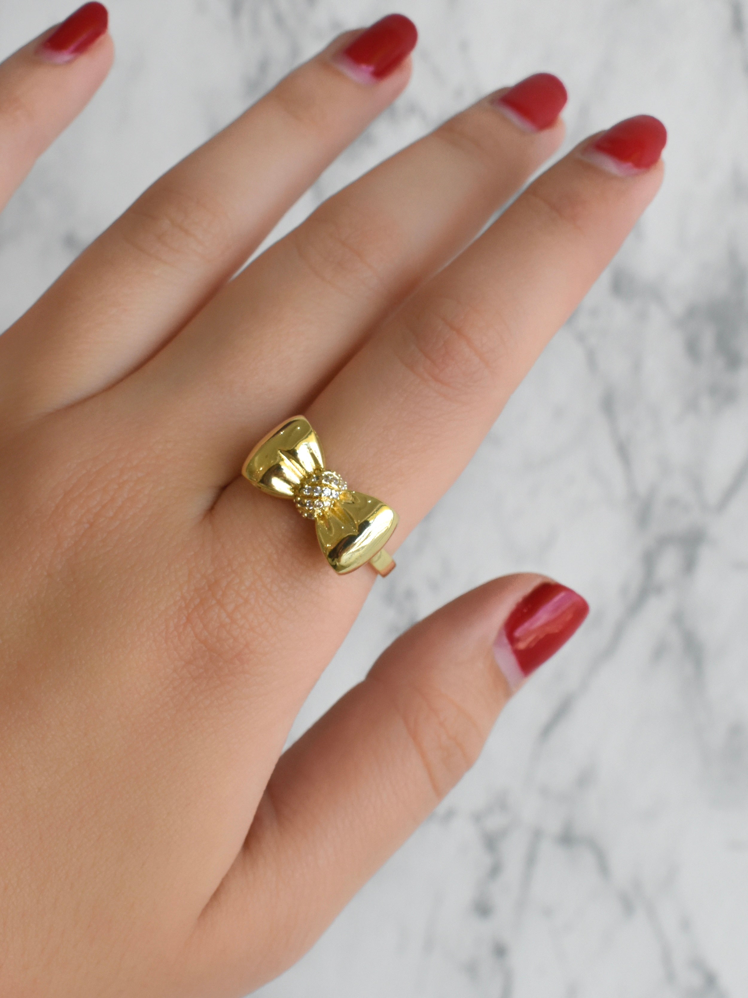 Anillo moño circonias (dorado o plateado)