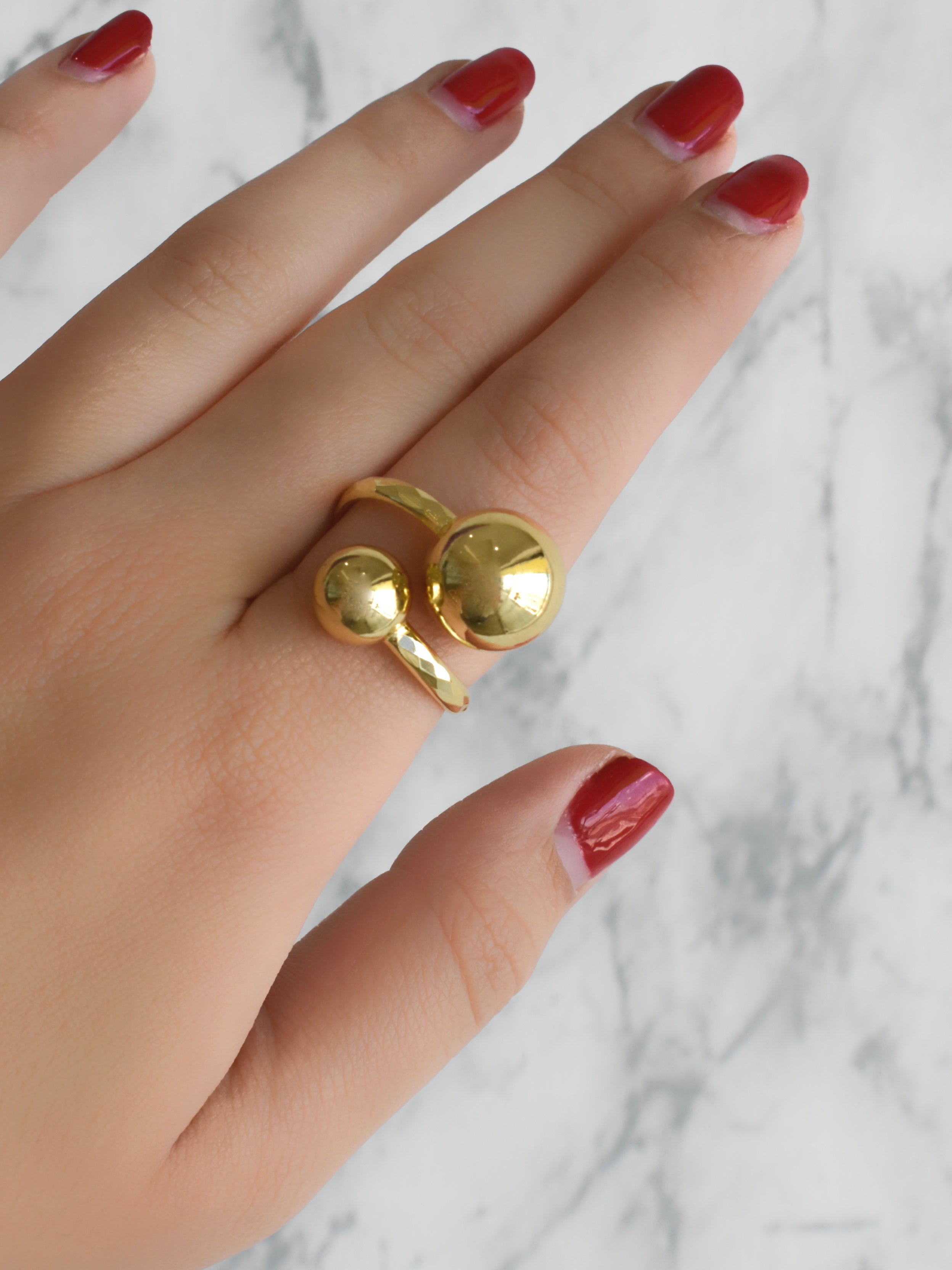 Anillo doble bola diamantado