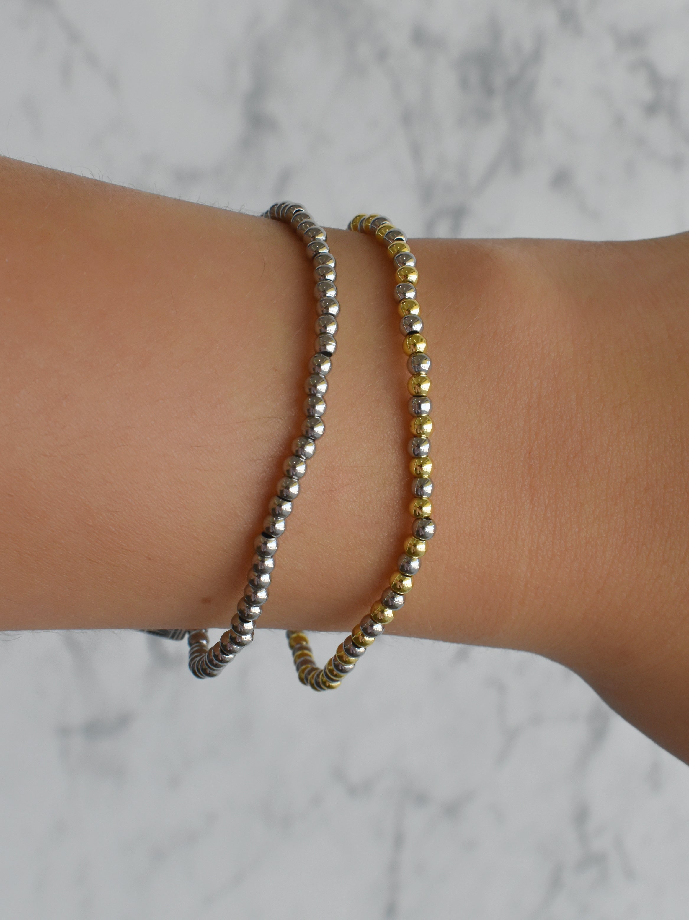 Pulsera mini bolitas (bicolor o plateada)