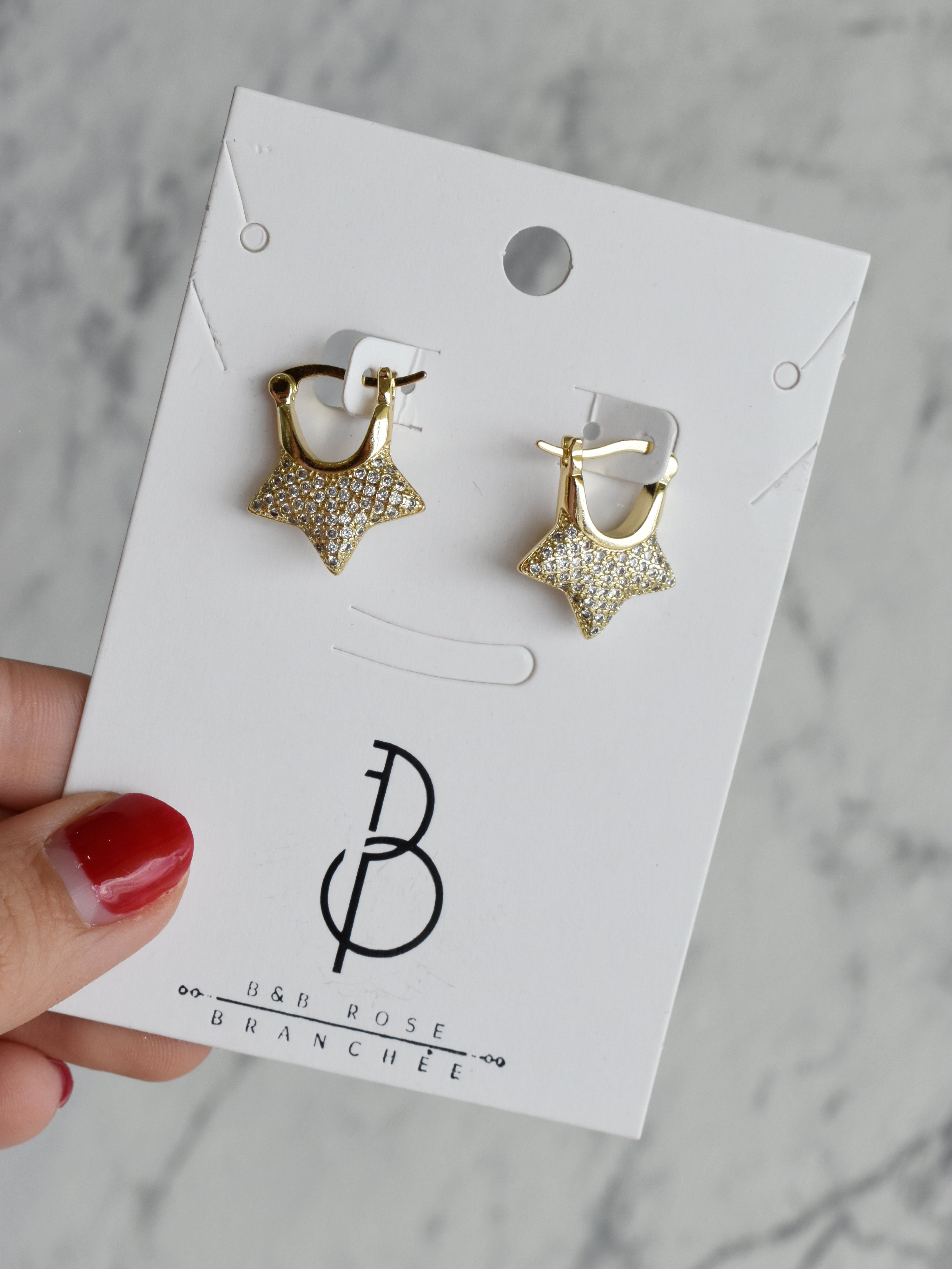 Aretes huggies media estrella circonias