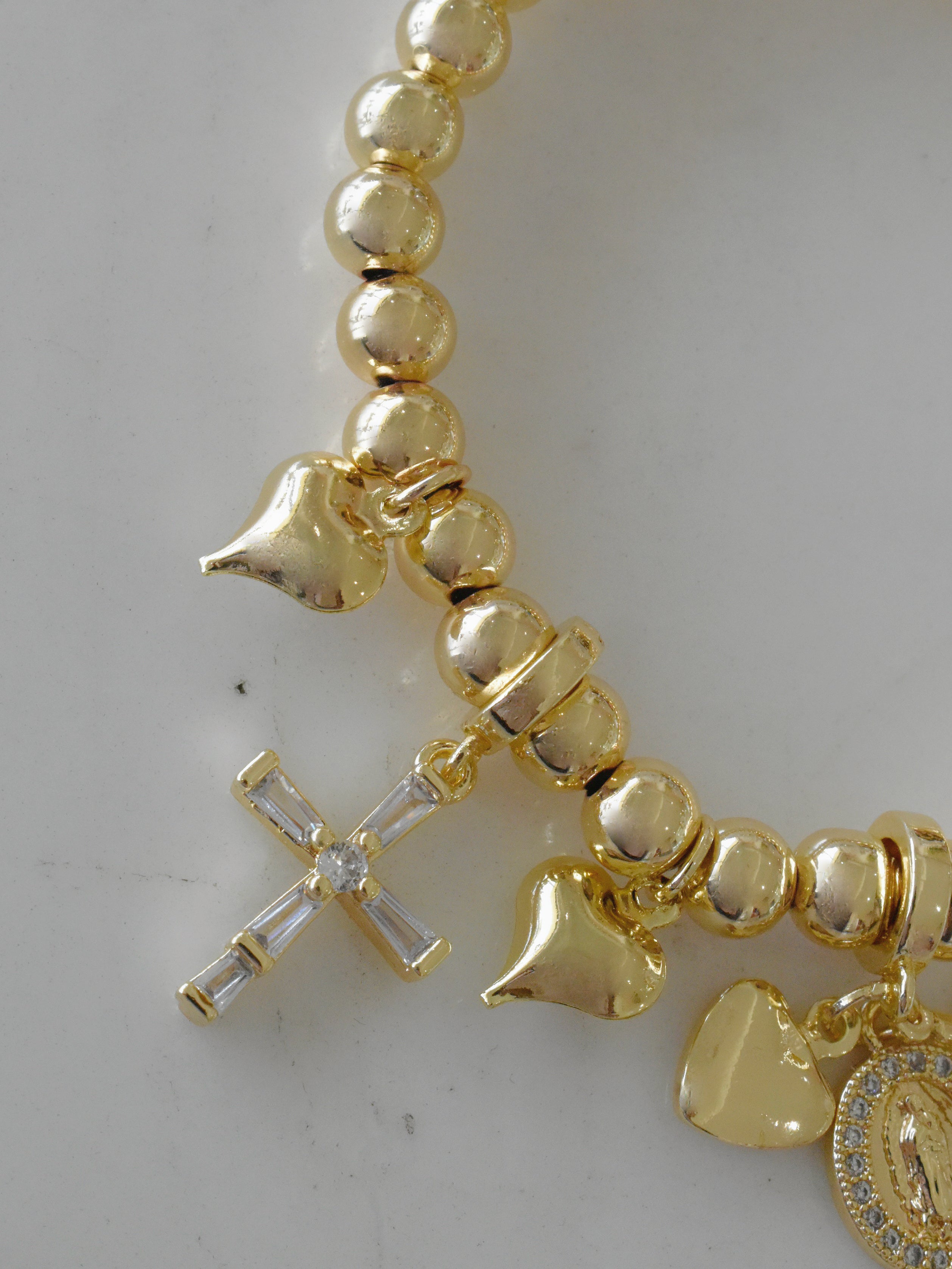 Pulsera charms religiosos