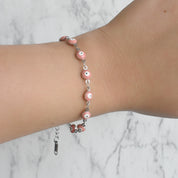 Pulsera plateada ojitos (rosa y roja)