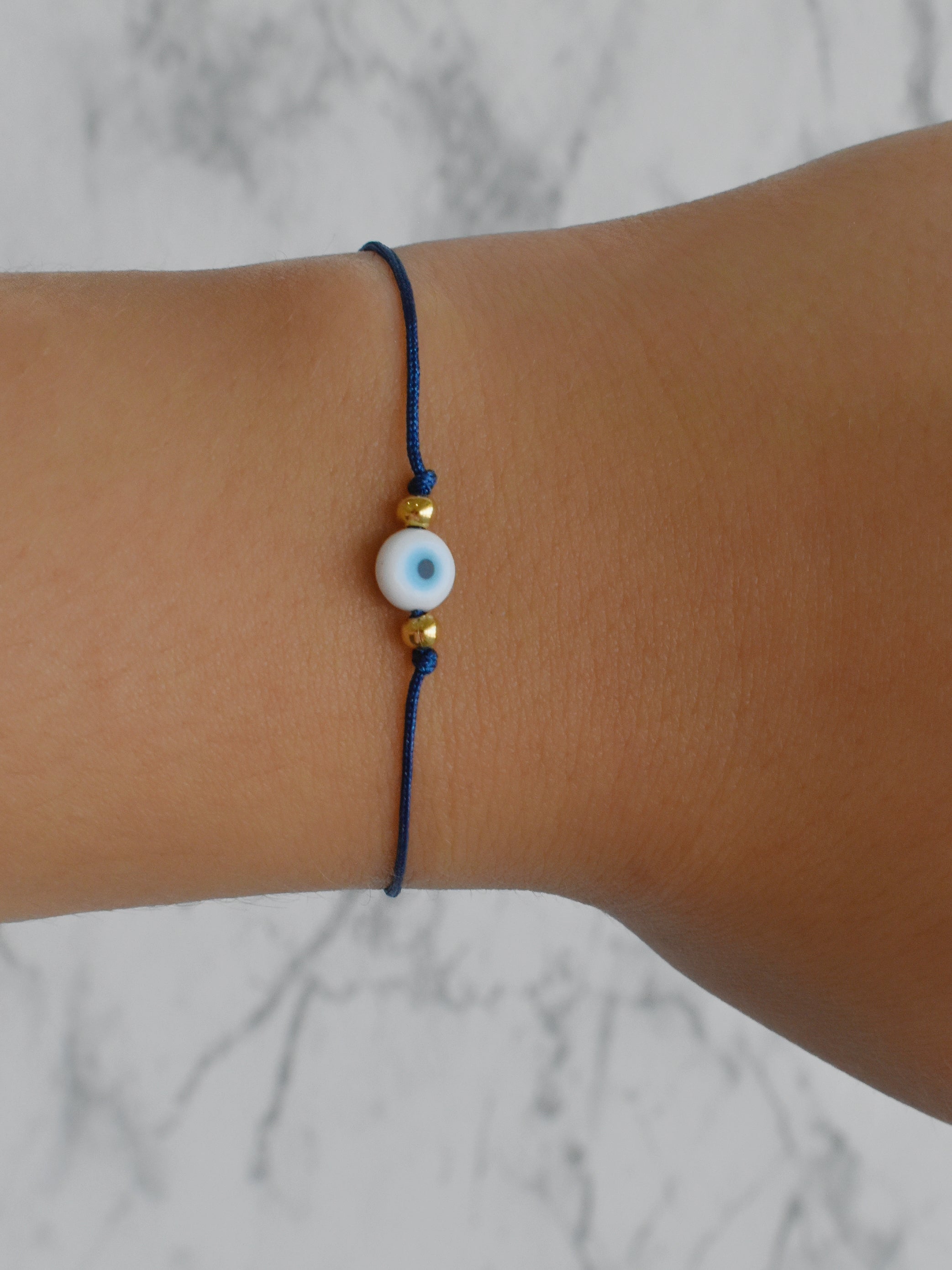 Pulsera hilo azul mini ojo