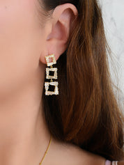 Arete largo de fiesta cuadros (dorado o plateado)