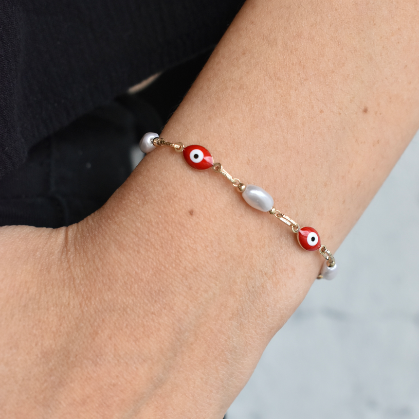 Pulsera ojito rojo eslabón y perla blanca